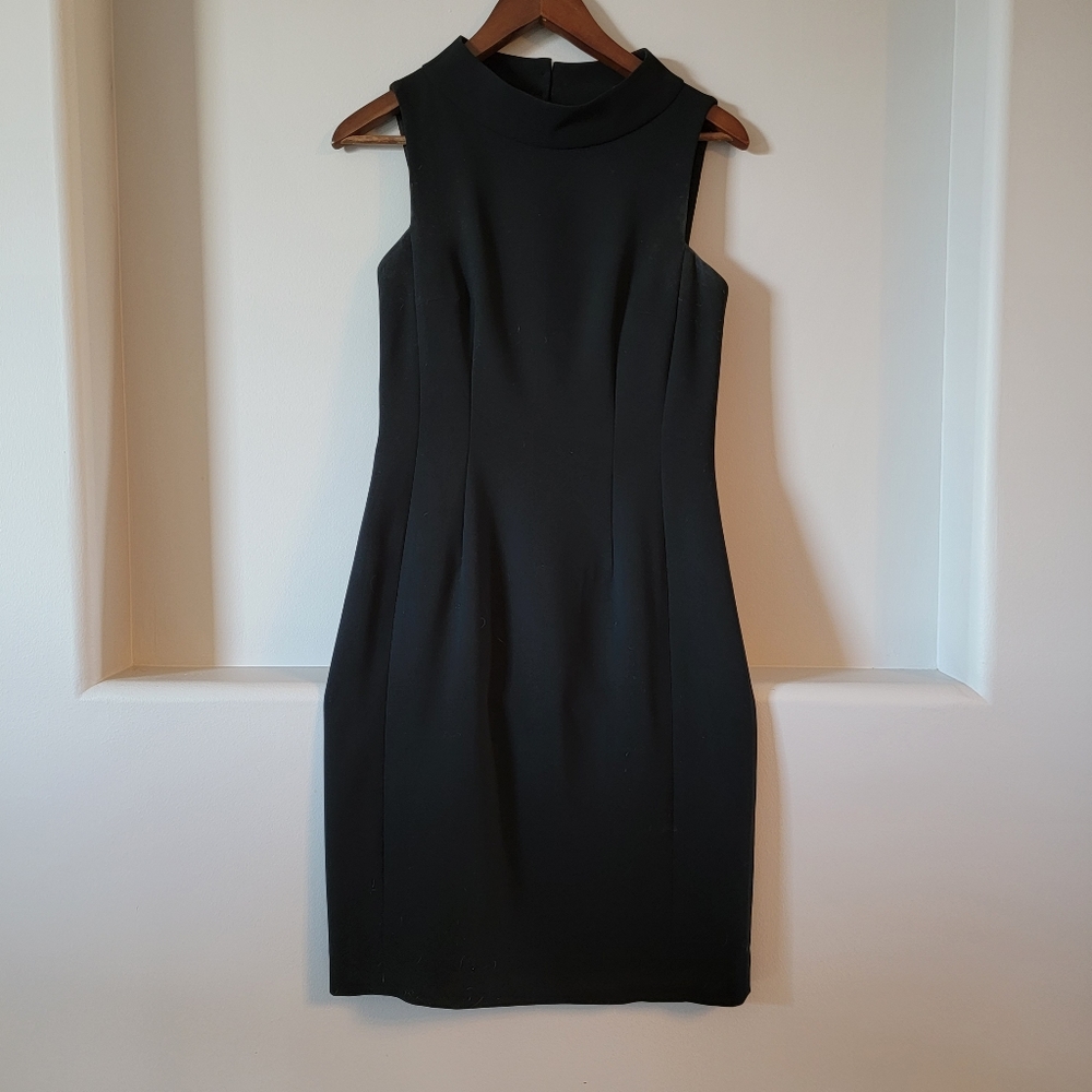 Sandra Augelazzi LBD. Size 32 US 2. High neck with cut out back.